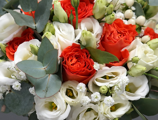 Bridal bouquet with orange roses, eustoma, gypsophila and eucalyptus photo